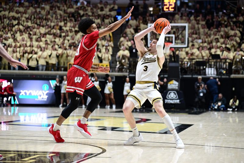 Mar 10, 2024; West Lafayette, Indiana, USA; Purdue Boilermakers guard Braden Smith (3) leans to get out of the way of Wisconsin Badgers guard Chucky Hepburn (23) during the second half at Mackey Arena. Mandatory Credit: Marc Lebryk-USA TODAY Sports