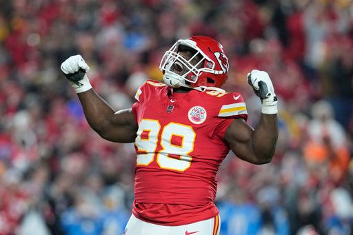 Kansas City Chiefs defensive tackle Tershawn Wharton celebrates after sacking Los Angeles Chargers quarterback Justin Herbert for a 4-yard loss during the first half of an NFL football game Sunday, Dec. 8, 2024, in Kansas City, Mo. (AP Photo/Ed Zurga)