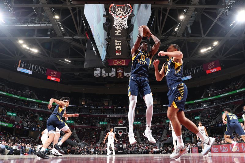 Cleveland, OH - OCTOBER 10: James Wiseman #13 of the Indiana Pacers goes up for the rebound during the game against the Cleveland Cavaliers during a NBA pre season game on October 10, 2024 at Rocket Mortgage Fieldhouse in Cleveland, Ohio. NOTE TO USER: User expressly acknowledges and agrees that, by downloading and or using this photograph, User is consenting to the terms and conditions of the Getty Images License Agreement. Mandatory Copyright Notice: Copyright 2024 NBAE (Photo by Jeff Haynes/NBAE via Getty Images)