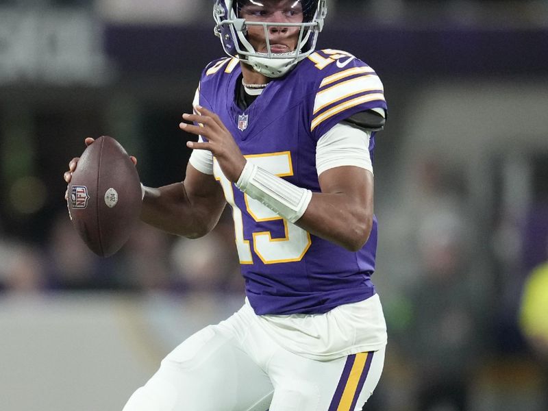 Minnesota Vikings quarterback Joshua Dobbs (15) looks to pass during the first half of an NFL football game against the Chicago Bears, Monday, Nov. 27, 2023, in Minneapolis. (AP Photo/Abbie Parr)