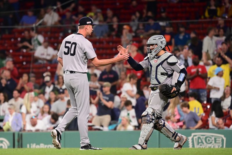 Jun 14, 2024; Boston, Massachusetts, USA; New York Yankees pitcher Michael Tonkin (50) and catcher Jose Trevino (39) celebrate beating the Boston Red Sox at Fenway Park. Mandatory Credit: Eric Canha-USA TODAY Sports