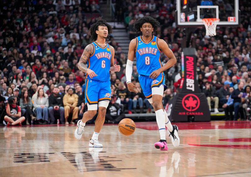 TORONTO, ON - MARCH 16: Jaylin Williams #6 and Jalen Williams #8 of the Oklahoma City Thunder against the Toronto Raptors during the first half of their basketball game at the Scotiabank Arena on March 16, 2023 in Toronto, Ontario, Canada. NOTE TO USER: User expressly acknowledges and agrees that, by downloading and/or using this Photograph, user is consenting to the terms and conditions of the Getty Images License Agreement. (Photo by Mark Blinch/Getty Images)