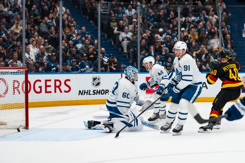 Jan 31, 2026; Vancouver, British Columbia, CAN; Toronto Maple Leafs defenseman Morgan Rielly (44) and goalie Joseph Woll (60) and forward John Tavares (91) react as Vancouver Canucks forward Elias Pettersson (40) celebrates a goal scored by defenseman Tom Willander (5) in the second period at Rogers Arena. Mandatory Credit: Bob Frid-Imagn Images