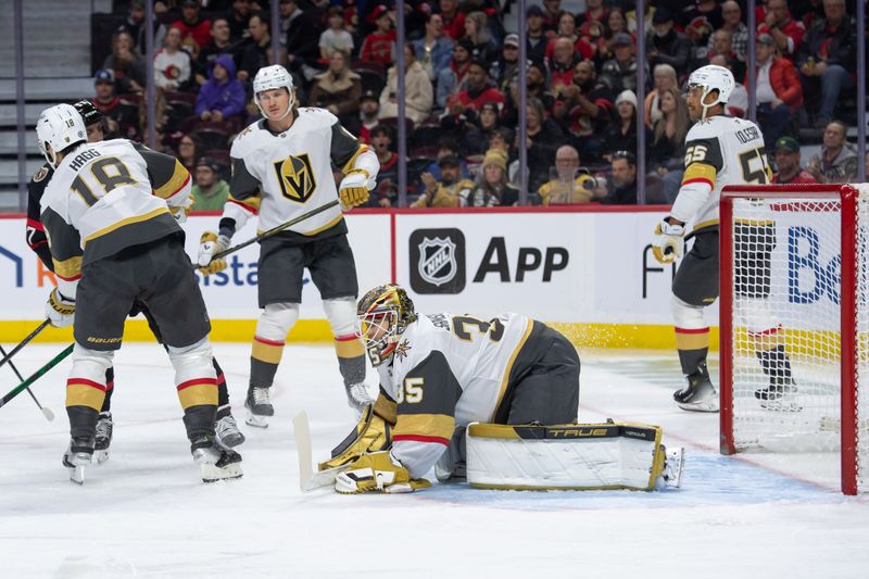 Nov 21, 2024; Ottawa, Ontario, CAN; Vegas Golden Knights goalie Ilya Samsonov (35) covers the puck in the firet period against the Ottawa Senators at the Canadian Tire Centre. Mandatory Credit: Marc DesRosiers-Imagn Images