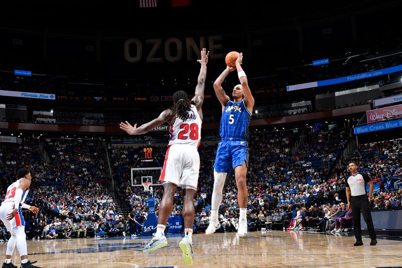 ORLANDO, FL - MARCH 3: Paolo Banchero #5 of the Orlando Magics shoots the ball during the game against the Detroit Pistons on March 3, 2024 at the Kia Center in Orlando, Florida. NOTE TO USER: User expressly acknowledges and agrees that, by downloading and or using this photograph, User is consenting to the terms and conditions of the Getty Images License Agreement. Mandatory Copyright Notice: Copyright 2024 NBAE (Photo by Fernando Medina/NBAE via Getty Images)