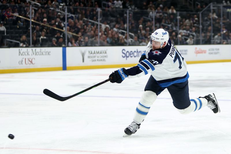 Nov 4, 2025; Los Angeles, California, USA;  Winnipeg Jets left wing Tanner Pearson (70) takes a slapshot during the third period against the Los Angeles Kings at Crypto.com Arena. Mandatory Credit: Kiyoshi Mio-Imagn Images