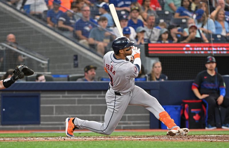 Jul 3, 2024; Toronto, Ontario, CAN; Houston Astros short stop Jeremy Pena hits a double in the sixth inning against the Toronto Blue Jays at Rogers Centre. Mandatory Credit: Gerry Angus-USA TODAY Sports