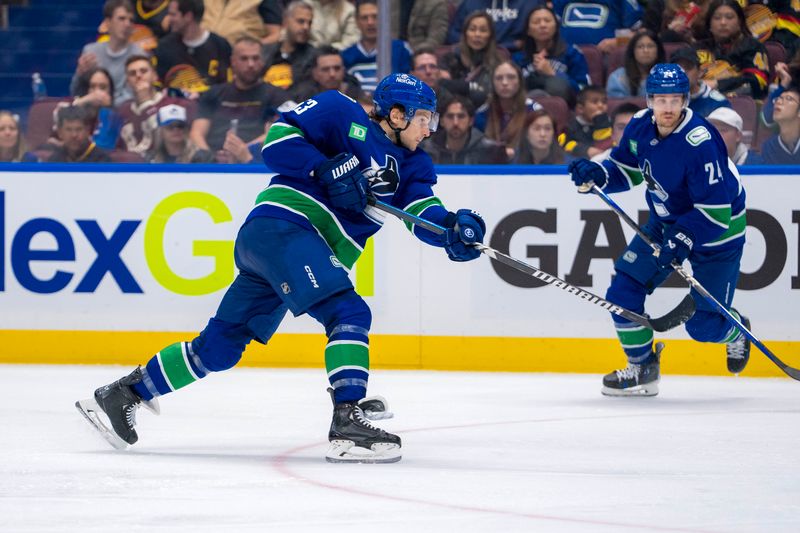 Oct 11, 2024; Vancouver, British Columbia, CAN; Vancouver Canucks forward Teddy Blueger (53) shoots against the Philadelphia Flyers during the third period at Rogers Arena. Mandatory Credit: Bob Frid-Imagn Images