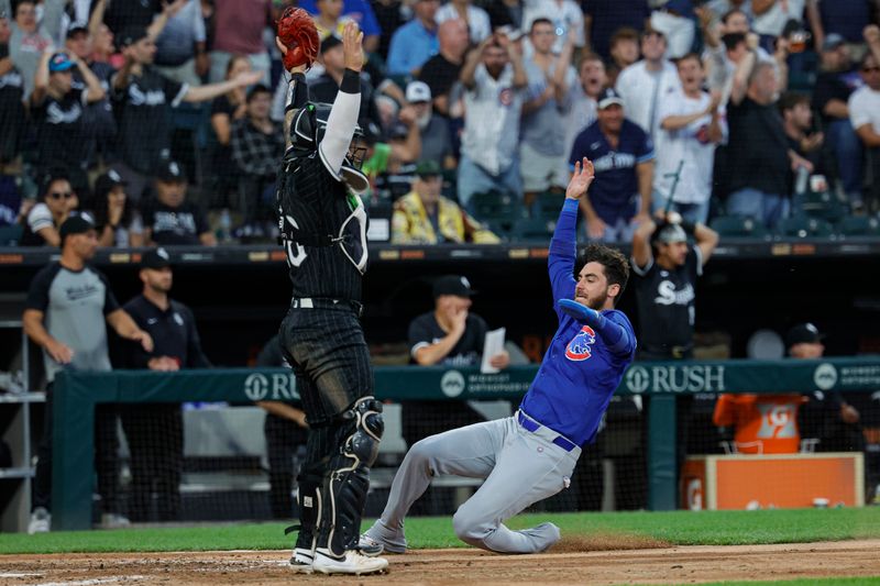 Aug 10, 2024; Chicago, Illinois, USA; Chicago Cubs outfielder Cody Bellinger (24) slides to score against the Chicago White Sox during the fifth inning at Guaranteed Rate Field. Mandatory Credit: Kamil Krzaczynski-USA TODAY Sports