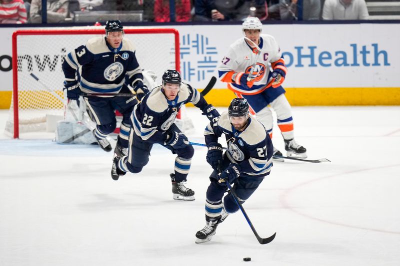 Oct 30, 2024; Columbus, Ohio, USA; Columbus Blue Jackets center Zachary Aston-Reese (27) skates with the puck against the New York Islanders in the second period at Nationwide Arena. Mandatory Credit: Samantha Madar-Imagn Images