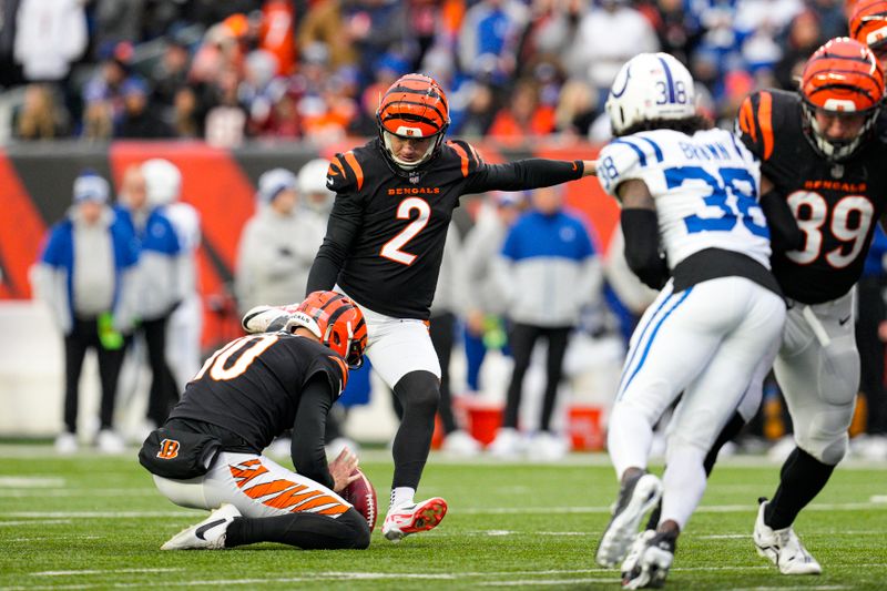 Cincinnati Bengals kicker Evan McPherson (2) kicks an extra point against the Indianapolis Colts in the second half of an NFL football game in Cincinnati, Sunday, Dec. 10, 2023. (AP Photo/Jeff Dean)