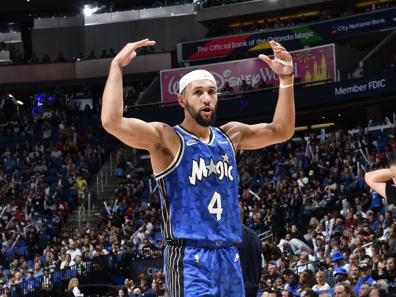 ORLANDO, FL - APRIL 14: Jalen Suggs #4 of the Orlando Magic reacts during the game against the Milwaukee Bucks on April 14, 2024 at Kia Center in Orlando, Florida. NOTE TO USER: User expressly acknowledges and agrees that, by downloading and or using this photograph, User is consenting to the terms and conditions of the Getty Images License Agreement. Mandatory Copyright Notice: Copyright 2024 NBAE (Photo by Fernando Medina/NBAE via Getty Images)