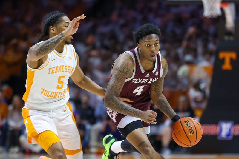 Feb 24, 2024; Knoxville, Tennessee, USA; Texas A&M Aggies guard Wade Taylor IV (4) moves the ball against Tennessee Volunteers guard Zakai Zeigler (5) during the first half at Thompson-Boling Arena at Food City Center. Mandatory Credit: Randy Sartin-USA TODAY Sports