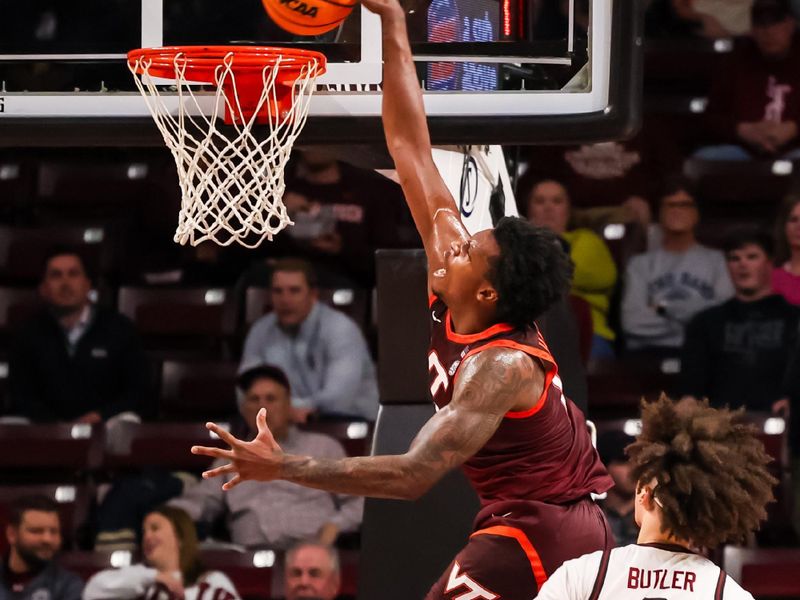 Dec 2, 2025; Columbia, South Carolina, USA; Virginia Tech Hokies forward Amani Hansberry (13) dunks against the South Carolina Gamecocks in the first half at Colonial Life Arena. Mandatory Credit: Jeff Blake-Imagn Images