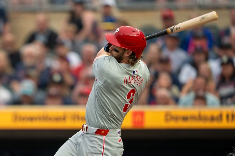 Jul 22, 2024; Minneapolis, Minnesota, USA; Philadelphia Phillies first baseman Bryce Harper (3) hits a two run home run against the Minnesota Twins in the first inning at Target Field. Mandatory Credit: Jesse Johnson-USA TODAY Sports