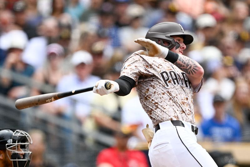 Jun 9, 2024; San Diego, California, USA; San Diego Padres center fielder Jackson Merrill (3) hits into a fielders choice during the second inning against the Arizona Diamondbacks at Petco Park. Mandatory Credit: Denis Poroy-USA TODAY Sports at Petco Park. 