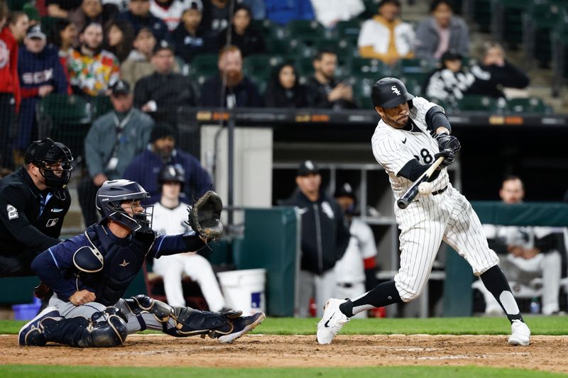 Apr 26, 2024; Chicago, Illinois, USA; Chicago White Sox left fielder Tommy Pham (28) singles against the Tampa Bay Rays during the eight inning at Guaranteed Rate Field. Mandatory Credit: Kamil Krzaczynski-USA TODAY Sports