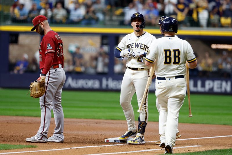 Oct 4, 2023; Milwaukee, Wisconsin, USA; Milwaukee Brewers shortstop Willy Adames (27) reacts at first base against Arizona Diamondbacks first baseman Christian Walker (53) in the first inning during game two of the Wildcard series for the 2023 MLB playoffs at American Family Field. Mandatory Credit: Kamil Krzaczynski-USA TODAY Sports