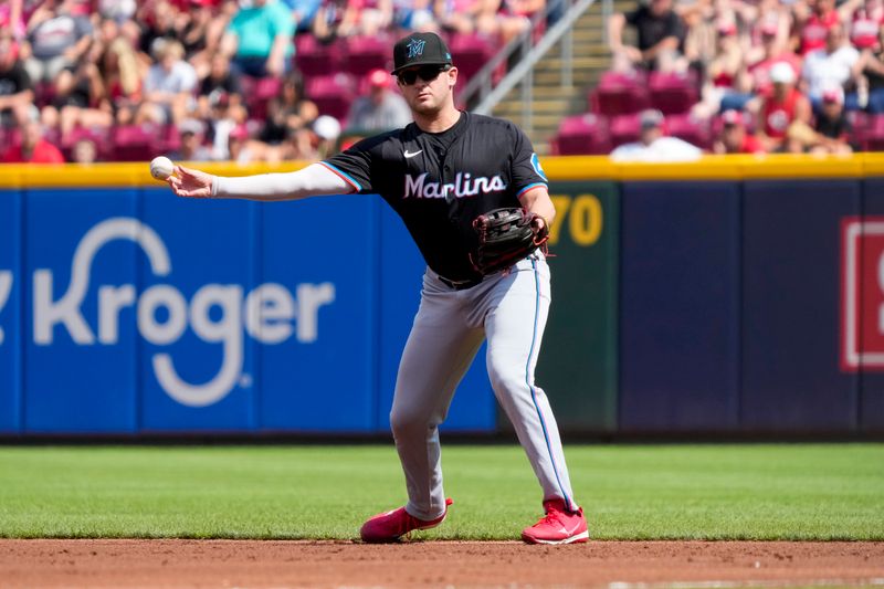 Jul 13, 2024; Cincinnati, Ohio, USA; Miami Marlins second baseman Jonah Bride (41) plays a ground ball off the bat of Jeimer Candelario for the third out of the bottom of the first inning of the MLB National League game between the Cincinnati Reds and the Miami Marlins at Great American Ball Park in downtown Cincinnati on Saturday, July 13, 2024. Mandatory Credit: Sam Greene-The Cincinnati Enquirer-USA TODAY Sports