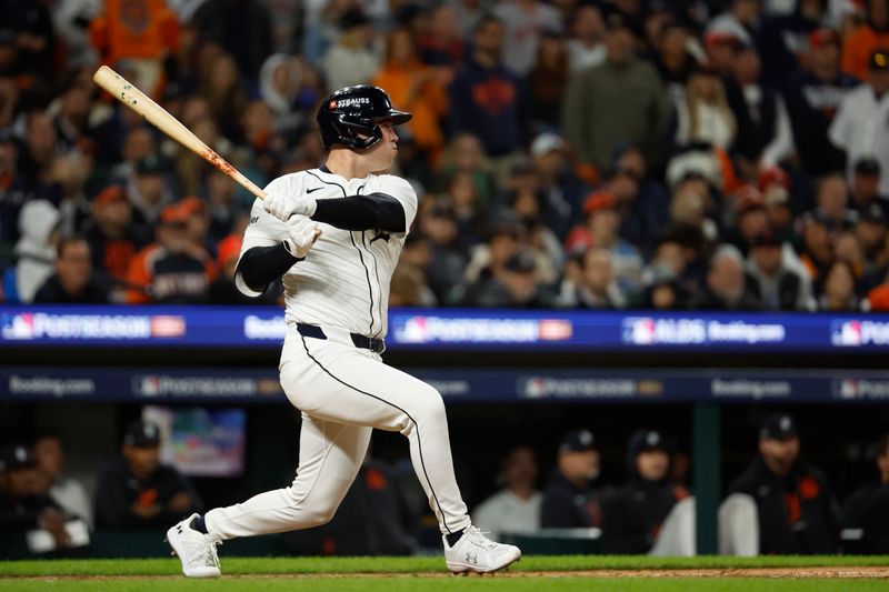 Oct 10, 2024; Detroit, Michigan, USA; Detroit Tigers outfielder Kerry Carpenter (30) hits a single in the sixth inning against the Cleveland Guardians during game four of the ALDS for the 2024 MLB Playoffs at Comerica Park. Mandatory Credit: Rick Osentoski-Imagn Images