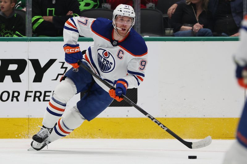 Oct 19, 2024; Dallas, Texas, USA; Edmonton Oilers center Connor McDavid (97) controls the puck against the Dallas Stars in the first period at American Airlines Center. Mandatory Credit: Tim Heitman-Imagn Images