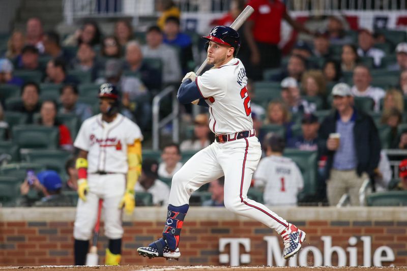 Apr 6, 2024; Atlanta, Georgia, USA; Atlanta Braves left fielder Jarred Kelenic (24) hits a single against the Arizona Diamondbacks in the first inning at Truist Park. Mandatory Credit: Brett Davis-USA TODAY Sports