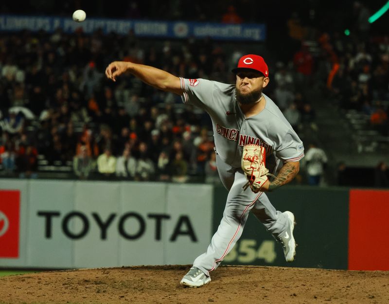 Aug 28, 2023; San Francisco, California, USA; Cincinnati Reds relief pitcher Daniel Duarte (77) pitches the ball against the San Francisco Giants during the eighth inning at Oracle Park. Mandatory Credit: Kelley L Cox-USA TODAY Sports