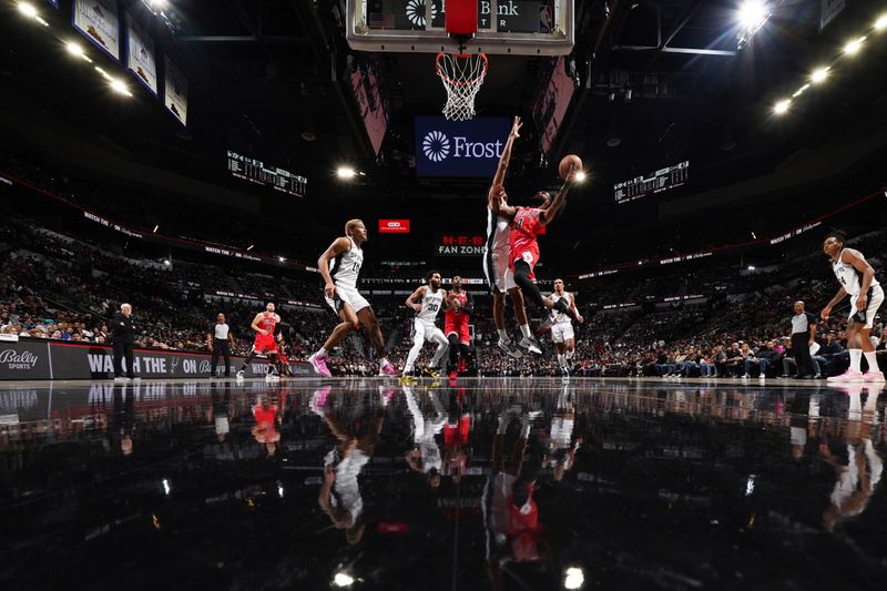 SAN ANTONIO, TX - JANUARY 13: Coby White #0 of the Chicago Bulls drives to the basket during the game against the Memphis Grizzlies on January 13, 2024 at the Frost Bank Center in San Antonio, Texas. NOTE TO USER: User expressly acknowledges and agrees that, by downloading and or using this photograph, user is consenting to the terms and conditions of the Getty Images License Agreement. Mandatory Copyright Notice: Copyright 2024 NBAE (Photos by Darren Carroll/NBAE via Getty Images)