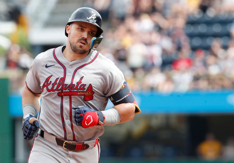 May 26, 2024; Pittsburgh, Pennsylvania, USA;  Atlanta Braves right fielder Adam Duvall (14) circles the bases on a solo home run against the Pittsburgh Pirates during the eighth inning at PNC Park. Atlanta won 8-1. Mandatory Credit: Charles LeClaire-USA TODAY Sports