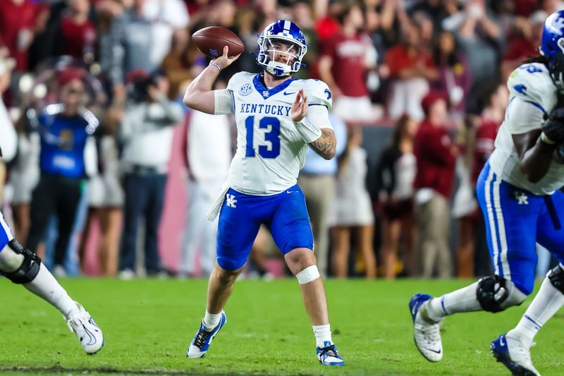 Nov 18, 2023; Columbia, South Carolina, USA; Kentucky Wildcats quarterback Devin Leary (13) passes against the South Carolina Gamecocks in the second half at Williams-Brice Stadium. Mandatory Credit: Jeff Blake-USA TODAY Sports Kentucky