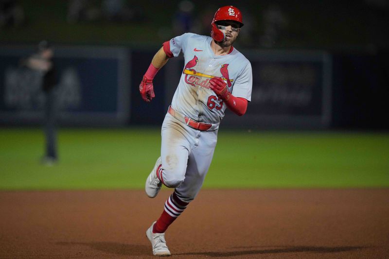 Mar 8, 2024; West Palm Beach, Florida, USA; St. Louis Cardinals center fielder Michael Siani (63) hits a triple in the fourth inning against the Washington Nationals at CACTI Park of the Palm Beaches. Mandatory Credit: Jim Rassol-USA TODAY Sports