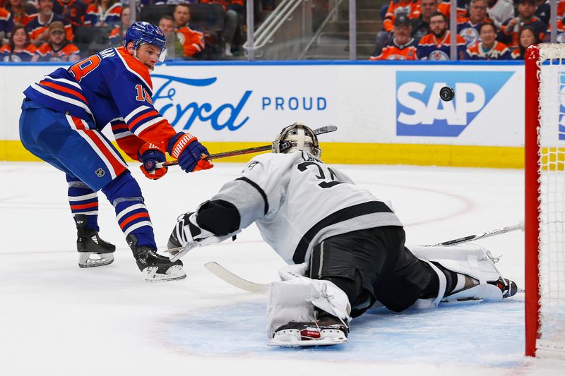 Apr 22, 2024; Edmonton, Alberta, CAN; Edmonton Oilers forward Zach Hyman (18) puts a shot just over Los Angeles Kings goaltender Cam Talbot (39) during the third period in game one of the first round of the 2024 Stanley Cup Playoffs at Rogers Place. Mandatory Credit: Perry Nelson-USA TODAY Sports