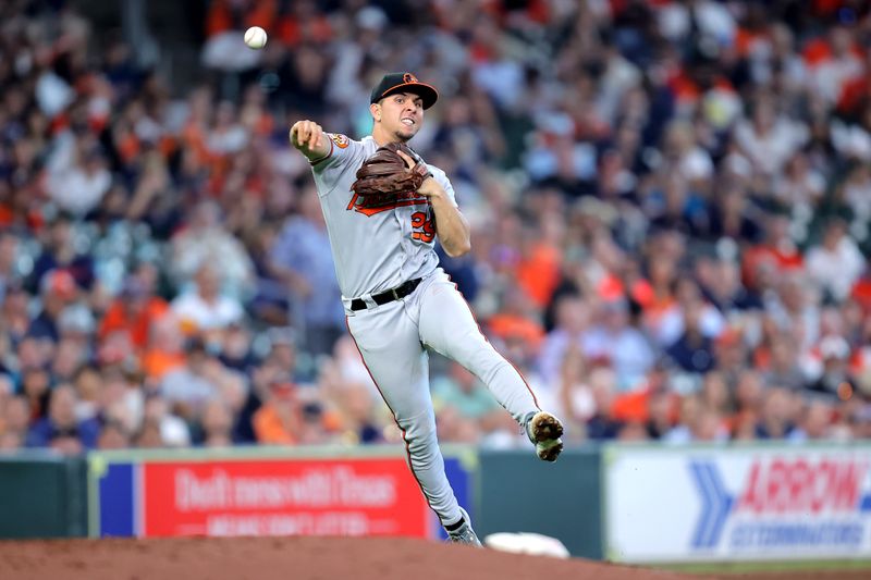 Sep 20, 2023; Houston, Texas, USA; Baltimore Orioles third baseman Ramon Urias (29) throws to first base against the Houston Astros during the third inning at Minute Maid Park. Mandatory Credit: Erik Williams-USA TODAY Sports