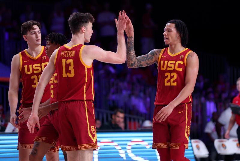 Nov 25, 2022; Paradise Island, BAHAMAS; USC Trojans guard Tre White (22) celebrates with USC Trojans guard Drew Peterson (13) during the first half against the Wisconsin Badgers  at Imperial Arena. Mandatory Credit: Kevin Jairaj-USA TODAY Sports