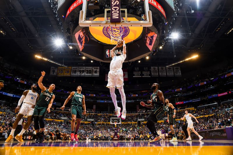 LOS ANGELES, CA - DECEMBER 13: Anthony Davis #3 of the Los Angeles Lakers dunks the ball during the game against the Boston Celtics on December 13, 2022 at Crypto.Com Arena in Los Angeles, California. NOTE TO USER: User expressly acknowledges and agrees that, by downloading and/or using this Photograph, user is consenting to the terms and conditions of the Getty Images License Agreement. Mandatory Copyright Notice: Copyright 2022 NBAE (Photo by Andrew D. Bernstein/NBAE via Getty Images)