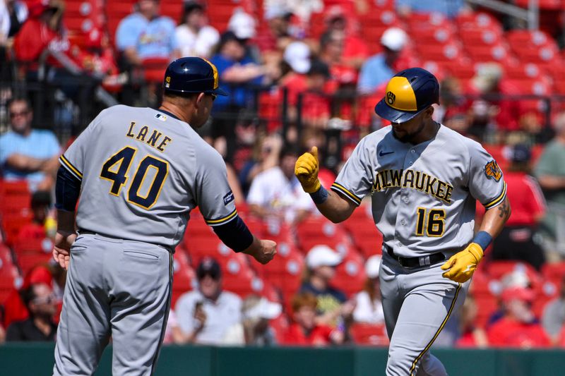 Sep 21, 2023; St. Louis, Missouri, USA;  Milwaukee Brewers center fielder Blake Perkins (16) is congratulated by third base coach Jason Lane (40) after hitting a solo home run against the St. Louis Cardinals during the third inning at Busch Stadium. Mandatory Credit: Jeff Curry-USA TODAY Sports