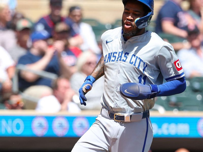 May 30, 2024; Minneapolis, Minnesota, USA; Kansas City Royals Maikel Garcia (11) scores on a double hit by Bobby Witt Jr. (7) during the third inning against the Minnesota Twins at Target Field. Mandatory Credit: Matt Krohn-USA TODAY Sports