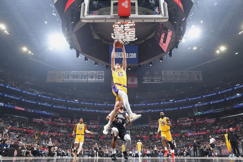 LOS ANGELES, CA - FEBRUARY 28: Austin Reaves #15 of the Los Angeles Lakers dunks the ball during the game against the LA Clippers on February 28, 2024 at Crypto.Com Arena in Los Angeles, California. NOTE TO USER: User expressly acknowledges and agrees that, by downloading and/or using this Photograph, user is consenting to the terms and conditions of the Getty Images License Agreement. Mandatory Copyright Notice: Copyright 2024 NBAE (Photo by Andrew D. Bernstein/NBAE via Getty Images)