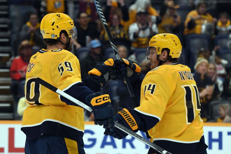 Feb 27, 2024; Nashville, Tennessee, USA; Nashville Predators defenseman Roman Josi (59) is congratulated by Nashville Predators center Gustav Nyquist (14) after scoring during the first period against the Ottawa Senators at Bridgestone Arena. Mandatory Credit: Christopher Hanewinckel-USA TODAY Sports