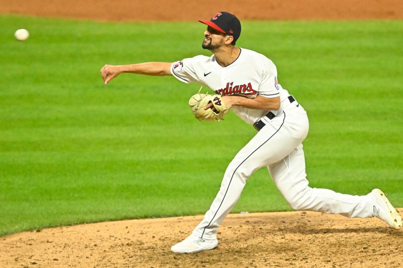 Sep 26, 2023; Cleveland, Ohio, USA; Cleveland Guardians relief pitcher Nick Sandlin (52) delivers a pitch in the the sixth inning against the Cincinnati Reds at Progressive Field. Mandatory Credit: David Richard-USA TODAY Sports