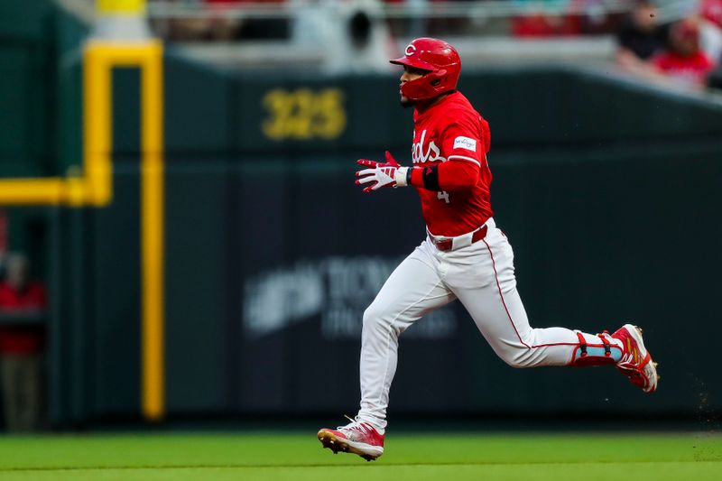 Apr 20, 2024; Cincinnati, Ohio, USA; Cincinnati Reds second baseman Santiago Espinal (4) runs to second after hitting a double in the fourth inning against the Los Angeles Angels at Great American Ball Park. Mandatory Credit: Katie Stratman-USA TODAY Sports