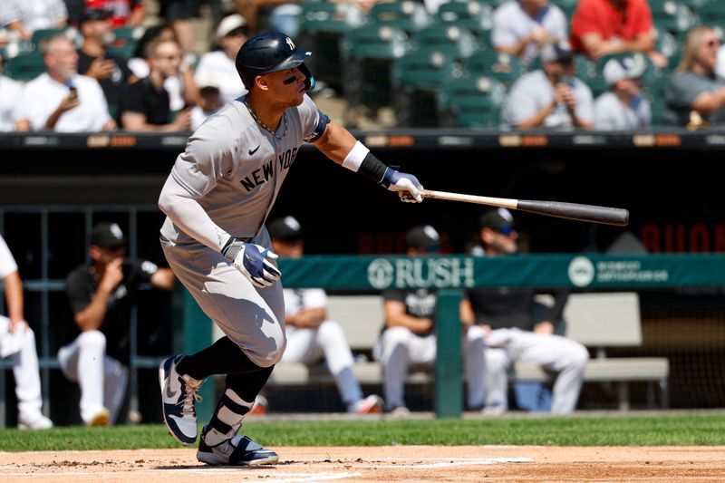 Aug 31, 2025; Chicago, Illinois, USA; New York Yankees designated hitter Aaron Judge (99) hits a solo home run against the Chicago White Sox during the first inning at Rate Field. Mandatory Credit: Kamil Krzaczynski-Imagn Images