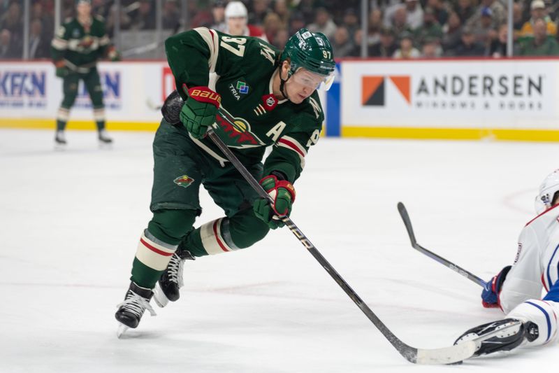 Dec 21, 2023; Saint Paul, Minnesota, USA; Minnesota Wild left wing Kirill Kaprizov (97) skates around a Montreal Canadiens player in the first period at Xcel Energy Center. Mandatory Credit: Matt Blewett-USA TODAY Sports