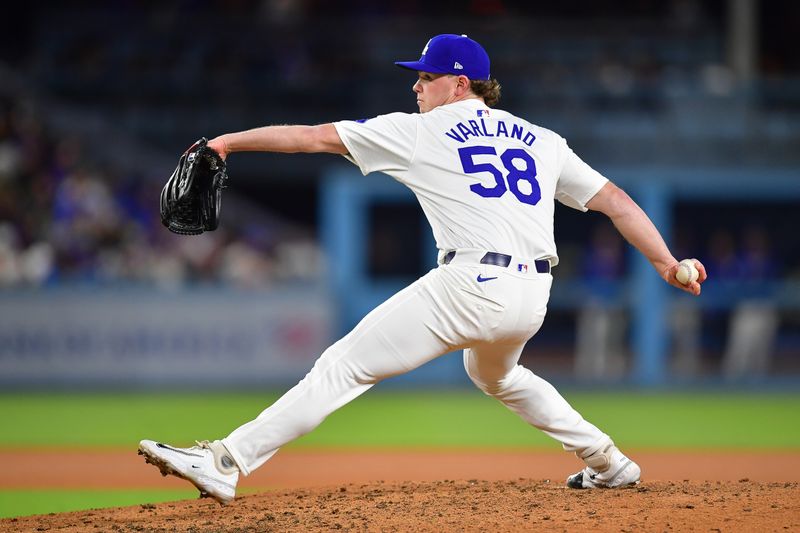 May 4, 2024; Los Angeles, California, USA; Los Angeles Dodgers pitcher Gus Varland (58) throws against the Atlanta Braves during the eighth inning at Dodger Stadium. Mandatory Credit: Gary A. Vasquez-USA TODAY Sports