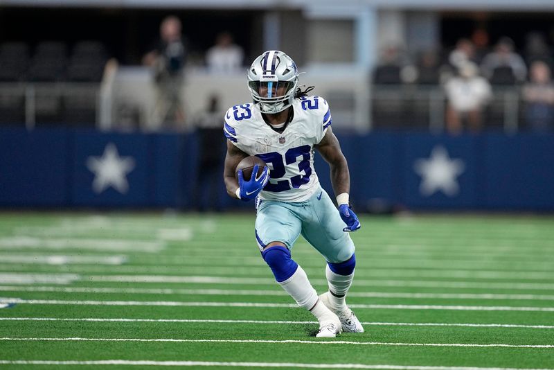 Dallas Cowboys running back Rico Dowdle carries the ball during a presesaon NFL football game against the Jacksonville Jaguars in Arlington, Texas, Saturday, Aug. 12, 2022. (AP Photo/Tony Gutierrez)