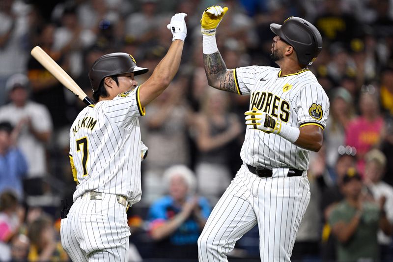 Aug 13, 2024; San Diego, California, USA; San Diego Padres right fielder David Peralta (24) celebrates with shortstop Ha-Seong Kim (7) after hitting a home run against the Pittsburgh Pirates during the fifth inning at Petco Park. Mandatory Credit: Orlando Ramirez-USA TODAY Sports