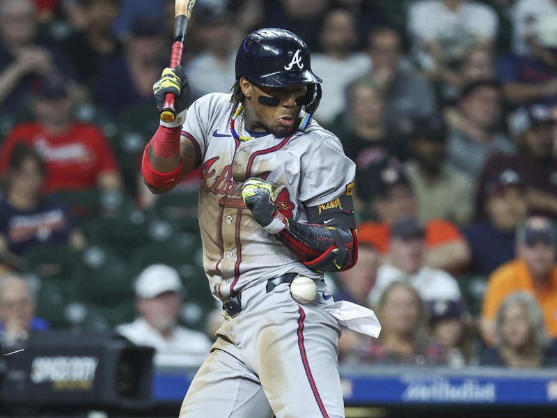 Apr 16, 2024; Houston, Texas, USA; Atlanta Braves right fielder Ronald Acuna Jr. (13) is hit by a pitch during the ninth inning against the Houston Astros at Minute Maid Park. Mandatory Credit: Troy Taormina-USA TODAY Sports