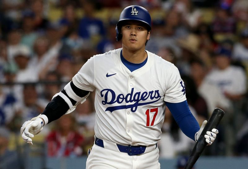 Jul 4, 2024; Los Angeles, California, USA; Los Angeles Dodgers designated hitter Shohei Ohtani (17) reacts after striking out during the seventh inning against the Arizona Diamondbacks at Dodger Stadium. Mandatory Credit: Jason Parkhurst-USA TODAY Sports