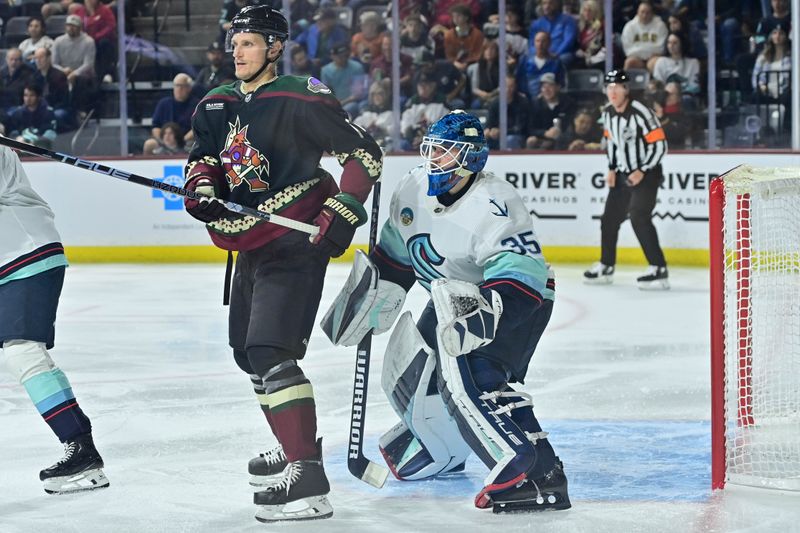 Nov 7, 2023; Tempe, Arizona, USA; Seattle Kraken goaltender Joey Daccord (35) tries to see around Arizona Coyotes center Nick Bjugstad (17) in the second period at Mullett Arena. Mandatory Credit: Matt Kartozian-USA TODAY Sports