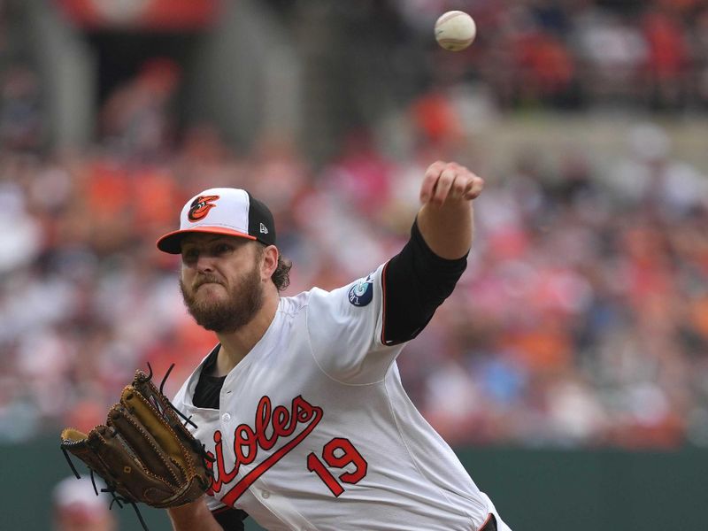 Jun 13, 2024; Baltimore, Maryland, USA; Baltimore Orioles pitcher Cole Irvin (19) delivers in the third inning against the Atlanta Braves at Oriole Park at Camden Yards. Mandatory Credit: Mitch Stringer-USA TODAY Sports